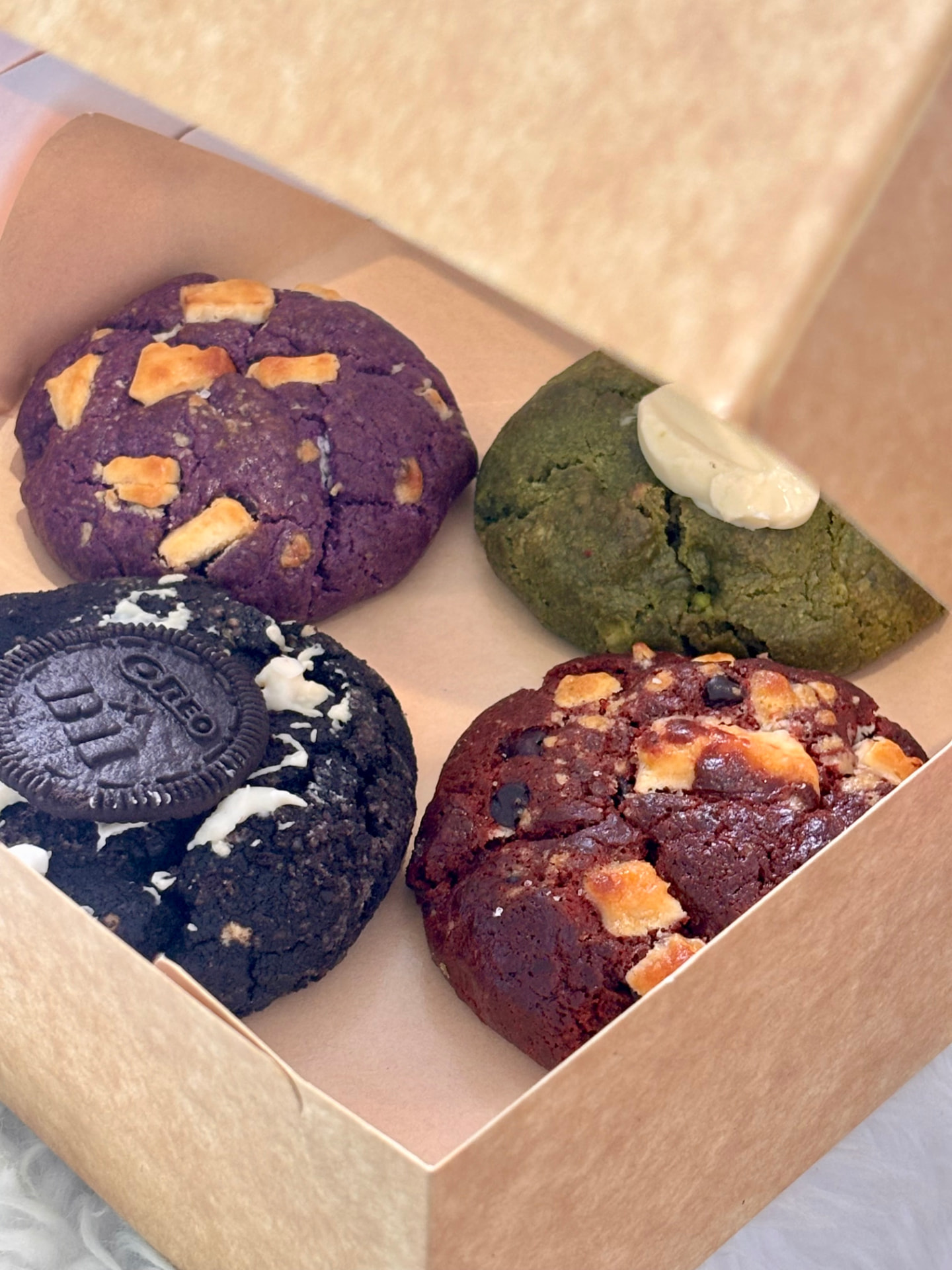 Assorted Hana Kumi cookies in a pink box: ube, matcha, Oreo and red velvet